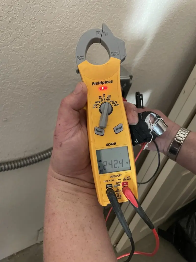Voltage testing with clamp meter during Ceiling Fan Installation in Lower Oxford